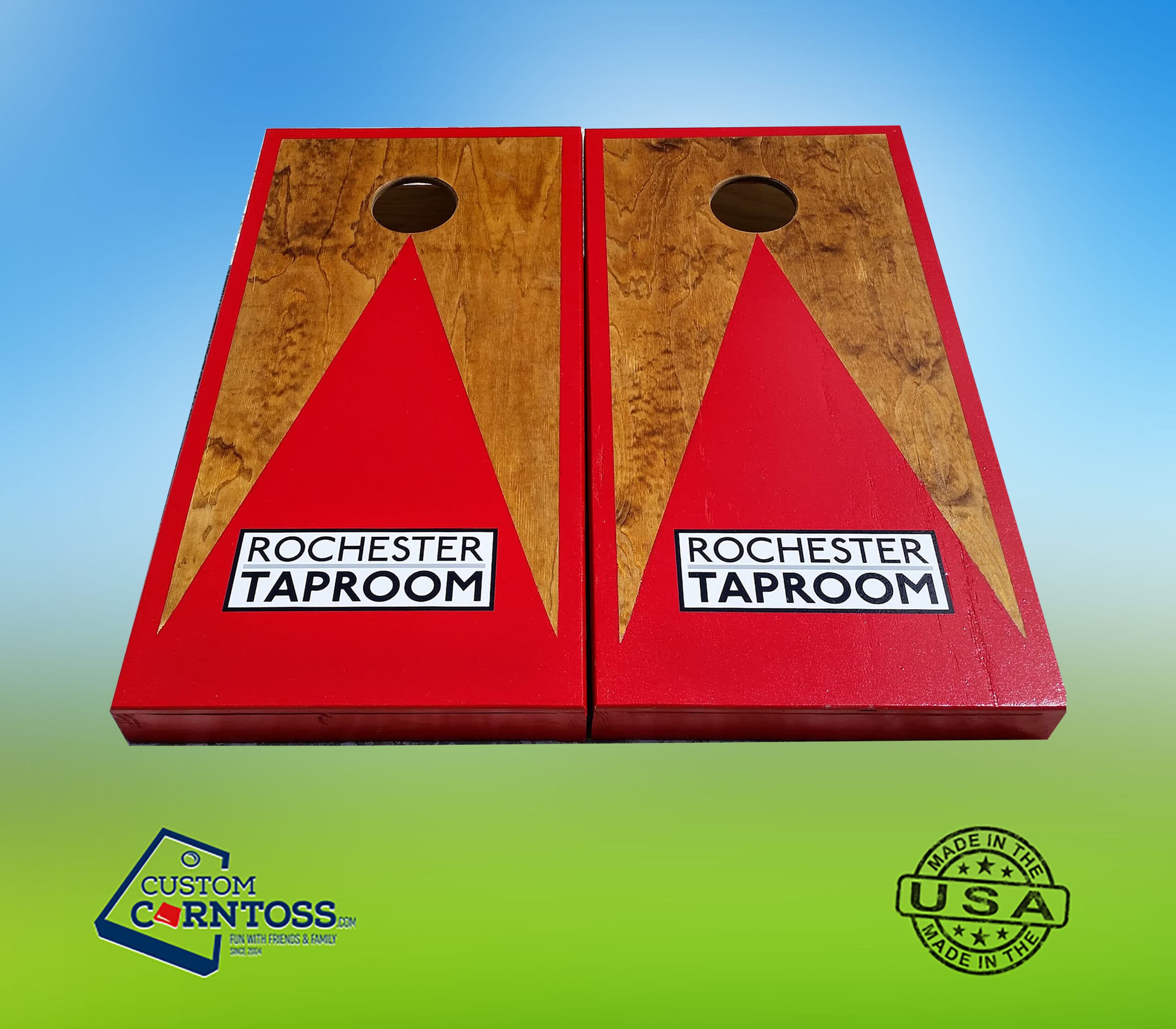 Custom cornhole boards with a red triangle and trim over stained wood, printed with the Rochester Taproom logo