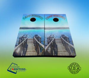 Custom Corntoss Camp Nokomis themed custom cornhole boards featuring a wooden dock on the water