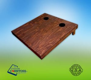 A side view of Custom Corntoss solid red oak cornhole board set
